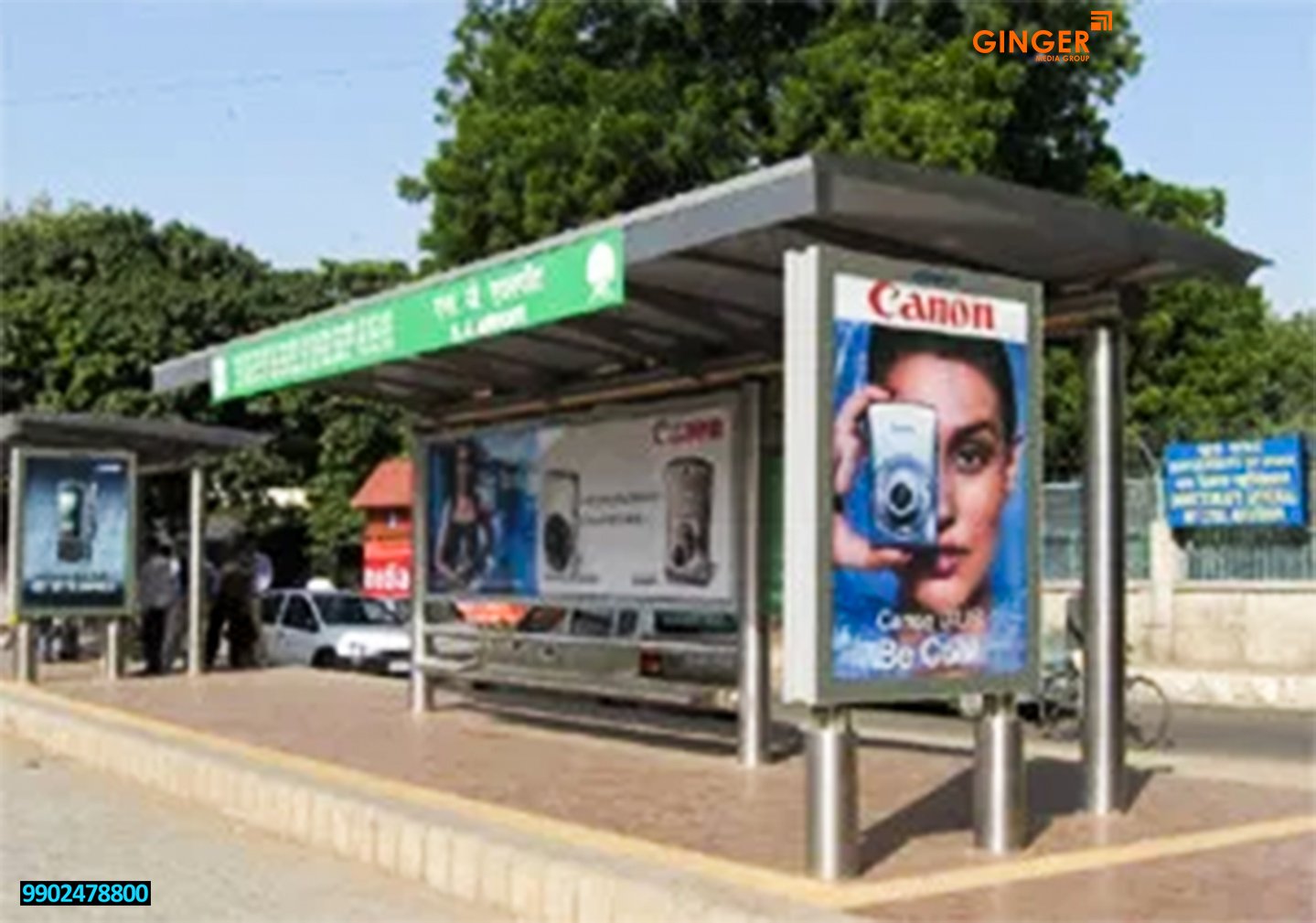 Outdoor bus shelter billboard display branding and illuminated street advertisement light box in Uganda