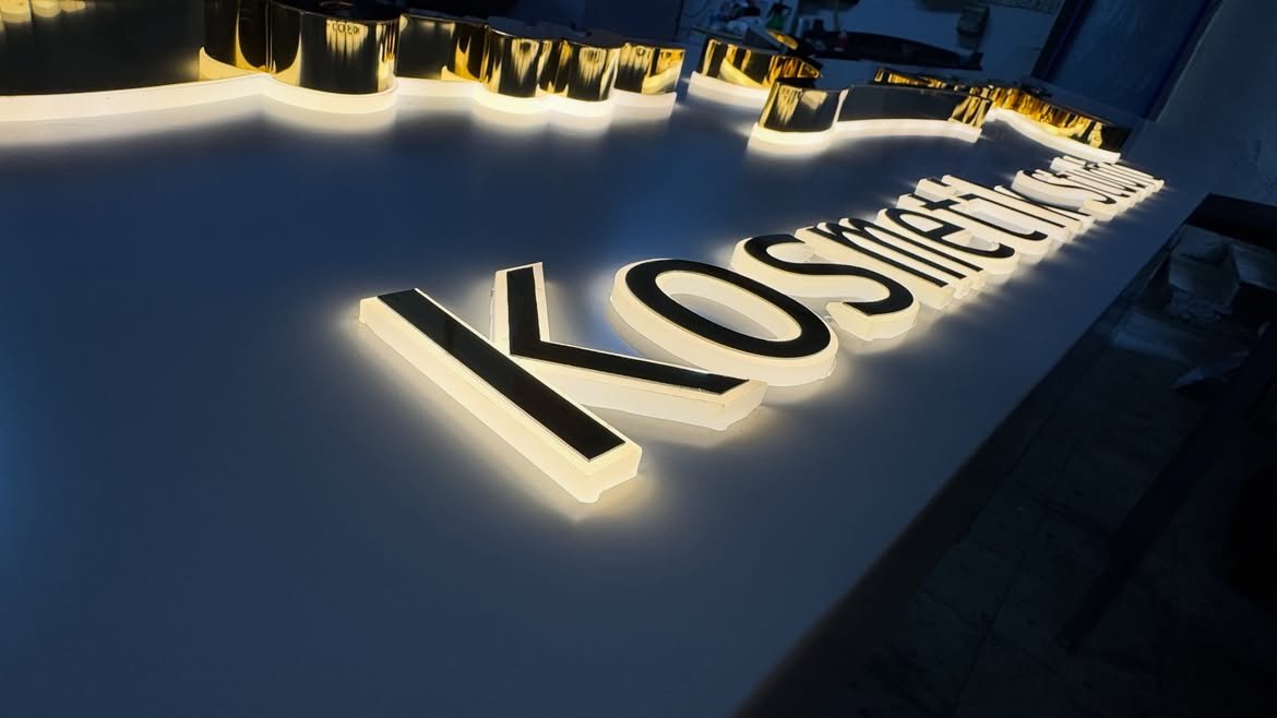 3D polished mirror gold stainless steel side-lit LED letters custom fabricated for corporate reception wall in Kololo, Kampala, Uganda.