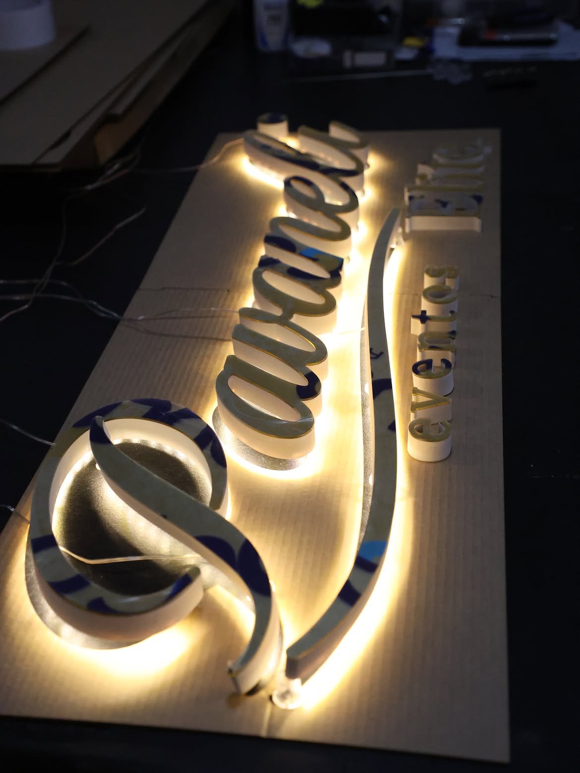 Custom 3D halo-lit script channel letters with warm white LED perimeter glow installed at events venue near Namboole Stadium, Bweyogerere, Uganda.