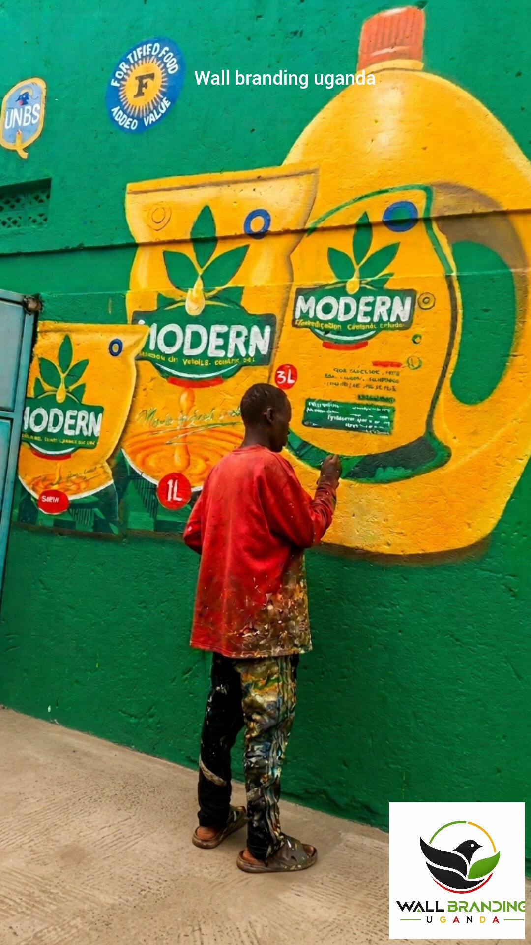Painter applying detailed product artwork for Modern Vegetable Cooking Oil industrial wall branding in Uganda